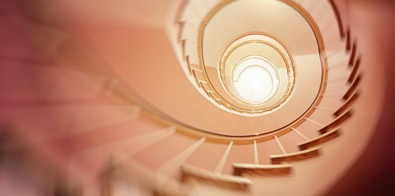 low angle photography of spiral stair